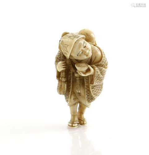 A stained ivory netsuke carved as a traveller wearing waraji and holding a gourd flask across the