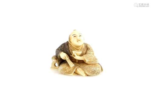 An ivory netsuke of a seated man holding a chawan in his left hand, and a folded fan in his right