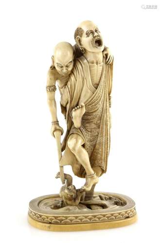 A very fine ivory okimono carved as a pair of Rakkan, rather in the guise of Ashinaga and Tenaga;