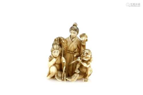 An ivory netsuke or small okimono carved as three figures, comprising a girl, an Oni, and a standing