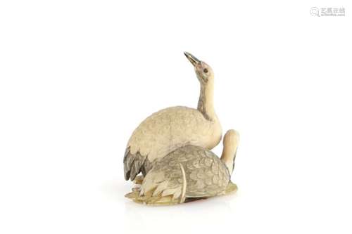 A small ivory okimono of a pair of red-crowned tsuru, 5cm high, 19th or 20th CenturyProvenance: