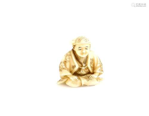 A stained ivory netsuke of a kneeling man, signed SeigyokuProvenance: The Property of a Lady. From a