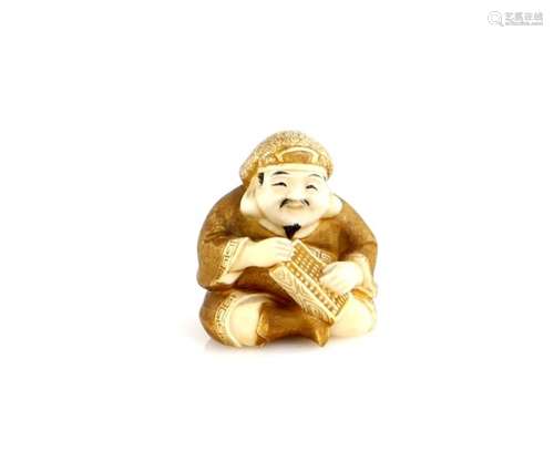 A heavily stained ivory netsuke of Daikoku with a soroban, signed Kogyoku, 20th CenturyProvenance: