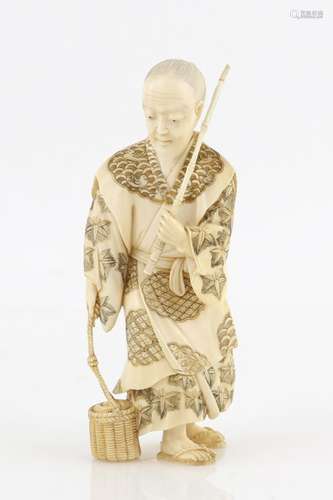 A stained ivory okimono of a fisherman, probably Urashima Taro in old age, holding a basket in the