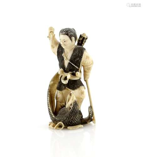 A heavily stained netsuke or small okimono carved as a man carrying a bow and killing a bird-of-