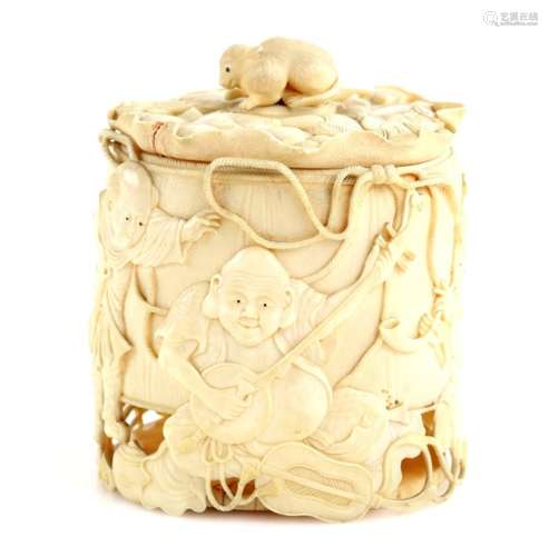 An ivory box and cover with rat finial, of nearly cylindrical form, carved on the exterior with