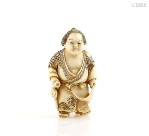 A stained ivory netsuke of a Sekitori holding up the hem of his kimono with his left hand, and