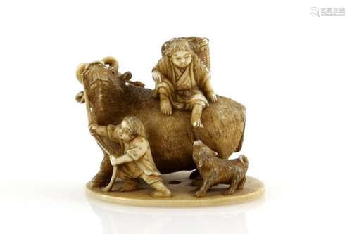 An okimono style netsuke with single himotoshi, carved as three farmers and a dog with a large bull,