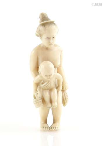 An ivory okimono of a mother holding her baby, 7 cm high, 20th CenturyProvenance: The Property of