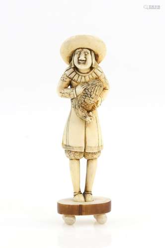 A stained ivory netsuke of a standing Dutchman from Deshima Island in Nagasaki Bay, wearing long