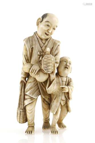 A stained ivory okimono carved as a standing man and his son with a tortoise, 9cm high, 19th or 20th