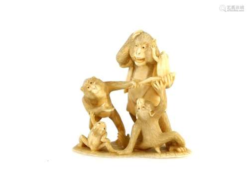 An ivory okimono of three apes beside two frogs, 7 cm high, 19th or 20th CenturyProvenance: The