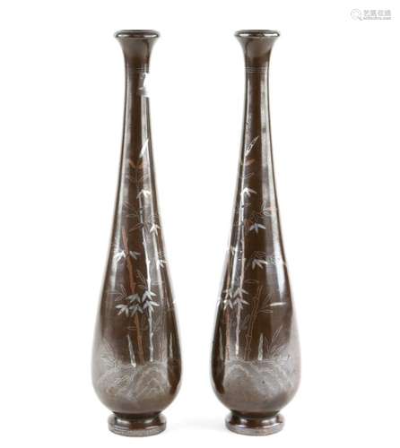 A pair of Japanese mixed metal ichirinzashi; each one decorated with bamboo and kanji; both about