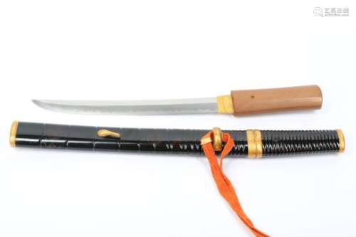 AN AIKUCHI (SHORT SWORD). Late Edo period. The blade of shinogi zukuri, itame hada, gunome hamon, in