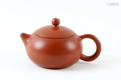 An Yixing Chinese squat ovoid tea pot and cover with loop handle, raised mark to base, 6.5cm high .