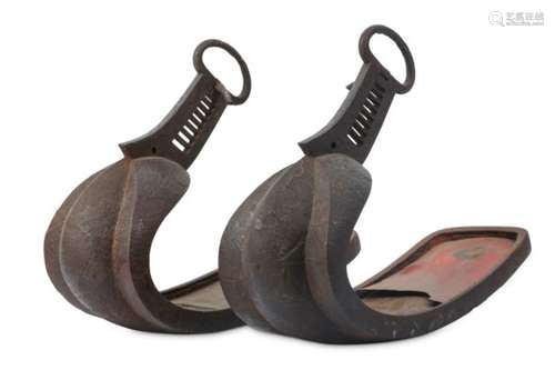 A PAIR OF IRON ABUMI (STIRRUPS). Edo period. Inlaid in silver with peonies, signed Kashu jy Naotomi,