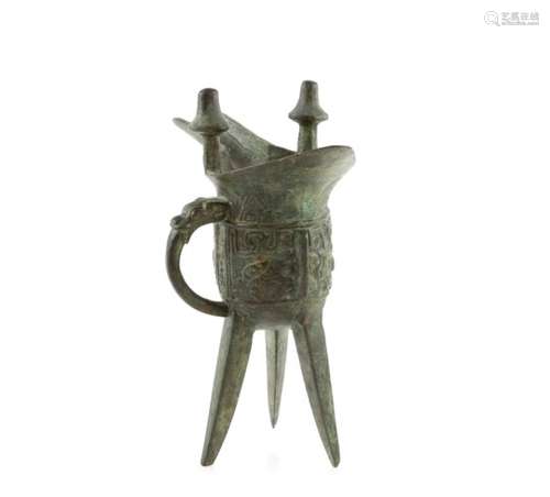 An archaistic metal jue, or ritual wine vessel, in the style of a Shang or Zhou Dynasty original; on