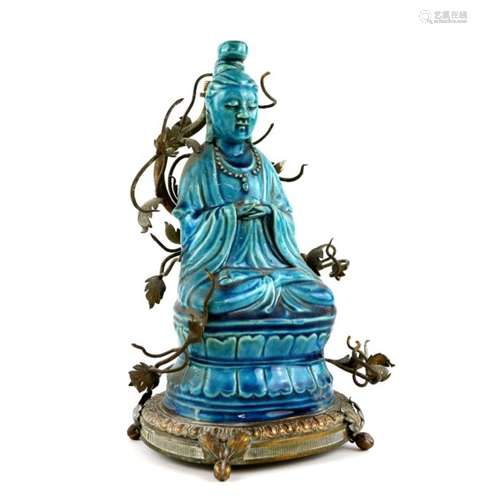 § A turquoise monochrome figure of a Buddhist Deity, seated on a lotus base in dhyanasana;