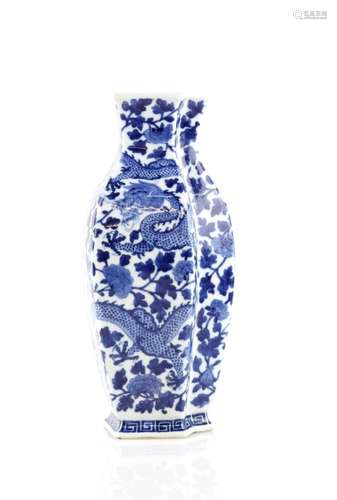 A blue and white Chinese vase, of double tapering form, decorated with a five-clawed dragon beside