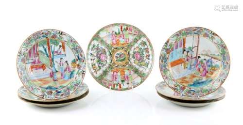 A set of six Canton famille rose shallow soup plates; each one decorated with a central design of