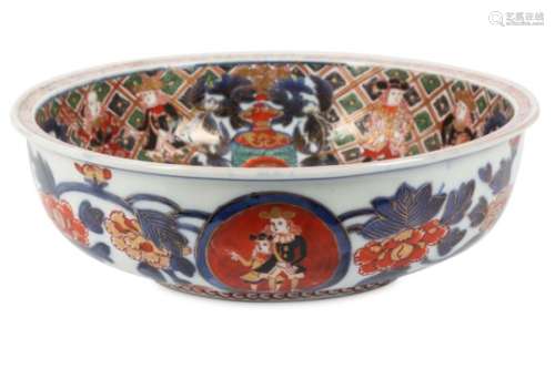 AN IMARI NAMBAN SHIP BOWL. Meiji period. The shallow bowl with a flat rim, painted in iron-red,