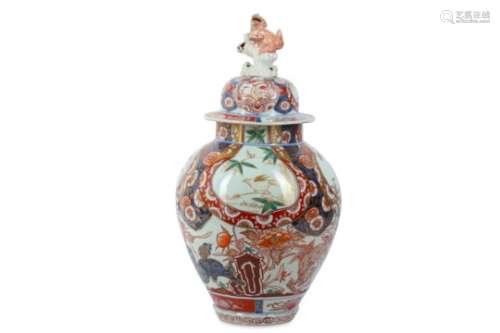 AN IMARI VASE AND COVER. 18th Century. The oviform body painted in iron red, green, and gilt with