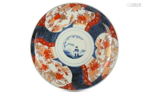 A LARGE IMARI CHARGER. 19th Century. Painted in underglaze blue, iron-red and gilt with a centre