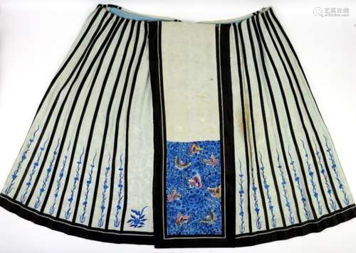 A Chinese textile, panelled skirt with a design of butterflies among blue peony, worked in satin