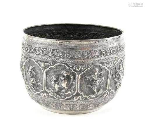 A Burmese, or other Asia, white metal bowl, decorated with a continuous design of figures on the