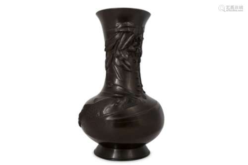 A BRONZE VASE. Meiji period. Finely cast and bearing a dark patina, decorated in high relief with