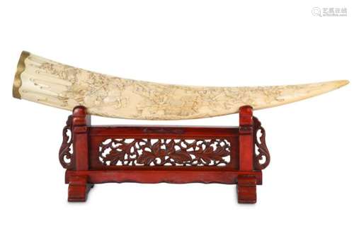 A CARVED MARINE IVORY OKIMONO ON A STAND. Meiji period. Carved with medieval samurai in a battle,