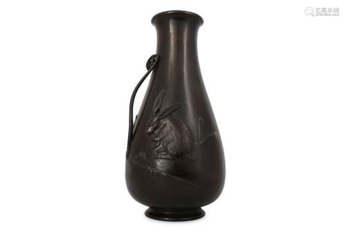 A BRONZE VASE. Meiji period. Of ovoid shape, decorated in chiselling and high relief with a hare and