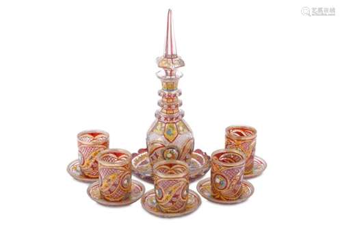 A SET OF FIVE RED AND GILT BOHEMIA CUT-GLASS BEAKERS WITH A DECANTER FOR THE IRANIAN MARKET