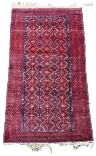 Property of a deceased estate - an early / mid 20th century Turkoman rug, 71 by 38ins. (181 by