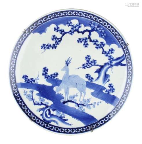 Property of a lady - a large Japanese blue & white charger, circa 1900, painted with two deer by a