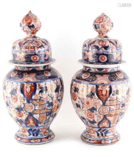 Property of a lady - a pair of 19th century Japanese Imari ribbed vases or jars & covers, 11.