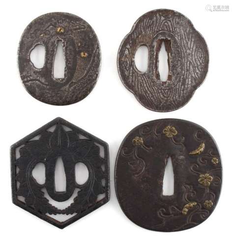 A collection of Japanese tsubas, 18th and 19th century, mixed metals - four assorted tsubas, one