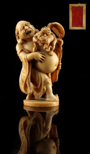 Property of a lady - a Japanese carved ivory okimono depicting Hotei with two oni, late Edo /