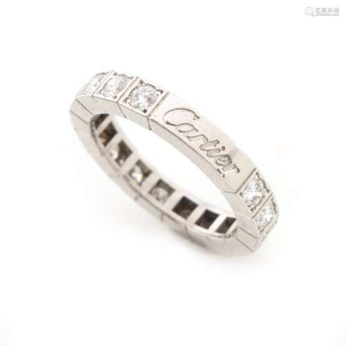 Cartier - a platinum diamond eternity ring by Cartier, set with sixteen round brilliant cut
