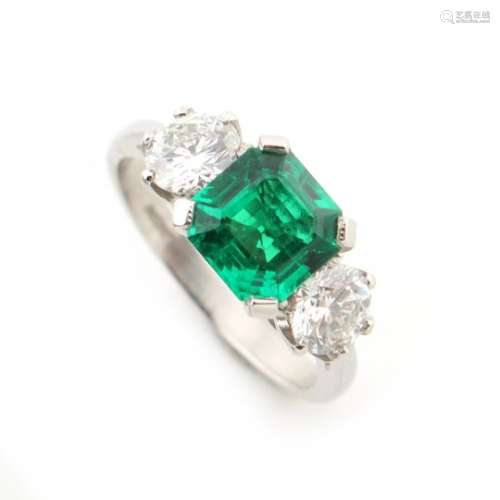 A fine platinum certificated emerald & diamond three stone ring, the octagonal cut Colombian emerald