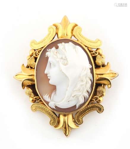 A Victorian unmarked yellow gold shell cameo brooch depicting a classical head wearing a lion head