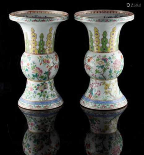 Property of a deceased estate - a pair of Chinese famille rose hu vases, painted in bright enamels
