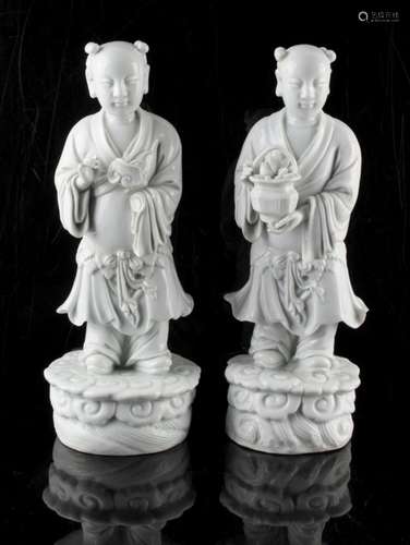 Property of a lady - a pair of Chinese blanc de chine figures of standing boys, 19th century, loss