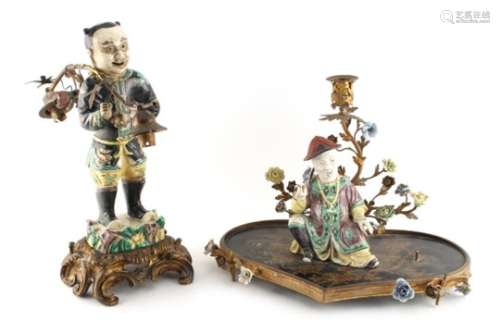 Property of a lady - two 19th century Chinese famille verte figures with gilt metal mounts, the