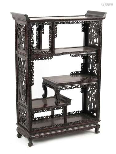 A Chinese carved hongmu display cabinet, late 19th / early 20th century, with open shelves, 45.3ins.