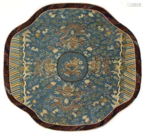 A 19th century Chinese kesi dragon quatrefoil panel, with a central dragon within a pale blue ground