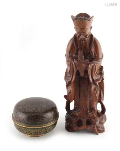 An early 20th century Chinese carved rootwood figure of an Immortal or scholar, 9.45ins. (24cms.)