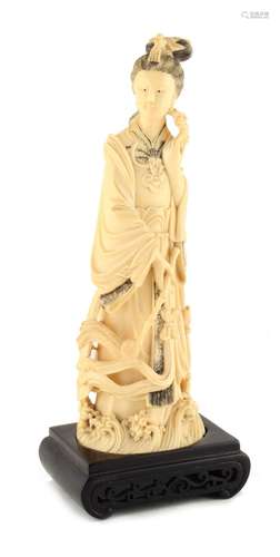 Property of a lady - an early 20th century Chinese carved ivory figure of Guanyin, 10ins. (25.4cms.)