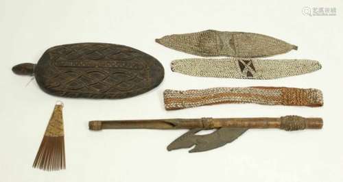 PNG, Sepik, spear thrower and Asmat, carved wooden pigment bowlherewith three body ornaments; two