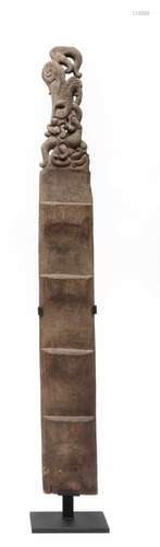 Borneo, Bahau, carved wooden ladderwith at the top a carved decorative ending with an animal.